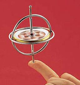 Image of a toy gyroscope. When you spin the wheel at high speed, the gyroscope is able to stand up vertically without falling over