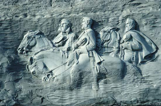 Stone Mountain, Georgia, an epic bas relief sculpture of Jefferson Davis, Robert E. Lee and Stonewall Jackson, on par with the exquisite workmanship of Mount Rushmore, which, regardless of artistic merit, may disappear for it's racist appearance of White men offending non-Whites.